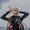 Diver getting ready to dive by setting up her Aqualung dive mask