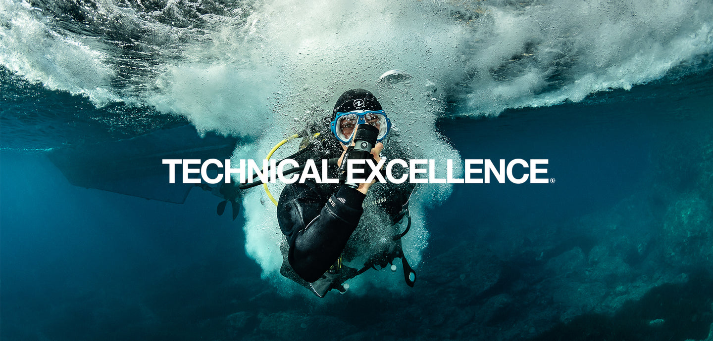 Diver under a breaking wave with 'Technical Excellence' text overlay
